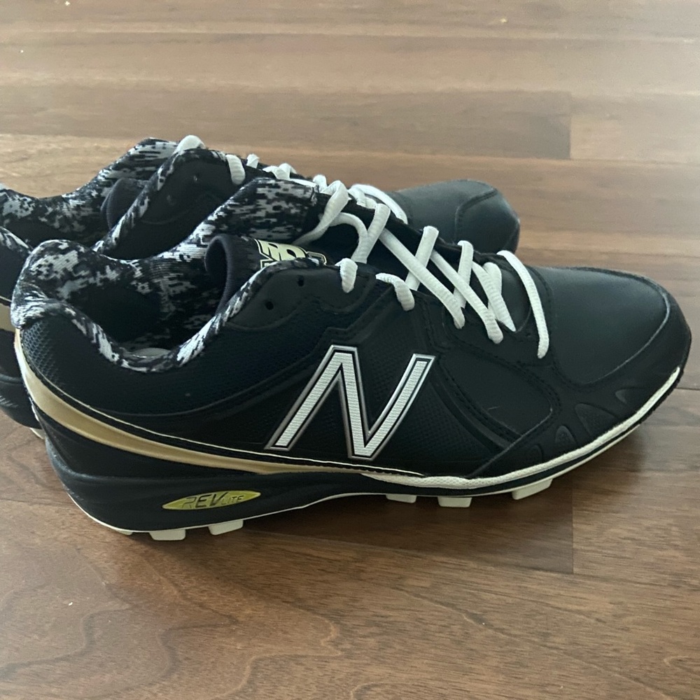 New Balance cleats size 9.5 M - brand new/ never worn